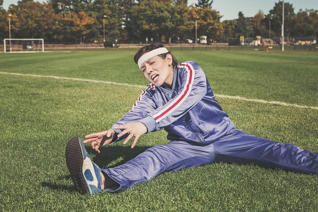 stretching, sports, woman, athlete, fitness, sport, healthy, exercise, workout, young, female, body, lifestyle, training, fit, health, stretch, people, active, girl, adult, person, sportswear, athletic, gym, exercising, physical, sporty, white, pilates, leisure, nature, tracksuit, track and field, shoes, headband, grass, field. A disclosure policy for fitness creators that triggers on benefit, not on format