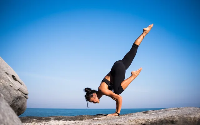 yoga, strength, woman, balance, nature, balancing, fit, fitness, young woman, fit woman, wellness, pose, yoga pose, posing, strength training, meditation, health, outdoors, beach, international yoga day. Fitness creator work in 2027: label the evidence, control the AI, keep health in scope